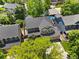 Home's aerial shot highlighting the roof and surrounding neighborhood, plus backyard with swimming pool at 6310 W Sumac Ave, Littleton, CO 80123