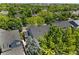 House aerial view showing roof, backyard, and mature trees offering privacy and shade at 6310 W Sumac Ave, Littleton, CO 80123