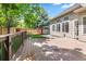Inviting wooden back deck with an enclosed yard, perfect for outdoor entertaining and relaxation at 6310 W Sumac Ave, Littleton, CO 80123