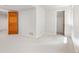 Spacious bedroom with neutral carpet and access to walk-in closet and bathroom at 6310 W Sumac Ave, Littleton, CO 80123