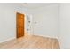 Cozy bedroom featuring hardwood floors, neutral paint, and ample natural light at 6310 W Sumac Ave, Littleton, CO 80123