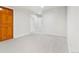 Bonus room featuring neutral carpet and wood trim at 6310 W Sumac Ave, Littleton, CO 80123