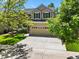 Lovely two-story home with well-maintained lawn, mature trees, and a spacious driveway at 6310 W Sumac Ave, Littleton, CO 80123