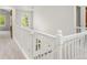 Bright hallway with natural light, white trim, and carpet at 6310 W Sumac Ave, Littleton, CO 80123
