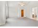Large primary bedroom with vaulted ceilings and neutral carpet at 6310 W Sumac Ave, Littleton, CO 80123