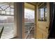 Balcony view featuring glass doors, a view of trees, and natural light at 1435 Vine St # 5, Denver, CO 80206