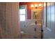 Charming bathroom featuring a black and white shower curtain, vanity and black and white tile flooring at 1435 Vine St # 5, Denver, CO 80206