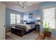 Serene bedroom with a ceiling fan, ample natural light, and comfortable furnishings at 1435 Vine St # 5, Denver, CO 80206