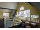 Bright bonus room with lots of light with seating and stairs leading down to another space at 1435 Vine St # 5, Denver, CO 80206