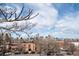 Panoramic city view showcasing downtown skyline amidst a residential neighborhood on a partly cloudy day at 1435 Vine St # 5, Denver, CO 80206