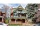 Detailed exterior view of a classic home showcasing its architectural design, color scheme, and welcoming front porch at 1435 Vine St # 5, Denver, CO 80206