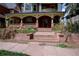 Charming front porch with decorative columns and detailed trim, leading to the home's inviting entrance at 1435 Vine St # 5, Denver, CO 80206