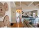 Inviting hallway with decorative wall art leading to kitchen and other living spaces at 1435 Vine St # 5, Denver, CO 80206