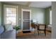 Bright office space with hardwood floors, a large window, and a neutral color scheme and a wooden drop leaf desk at 1435 Vine St # 5, Denver, CO 80206