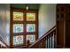 Close-up of a stained glass window featuring intricate patterns and a vibrant color palette along a staircase at 1435 Vine St # 5, Denver, CO 80206