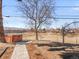 A view of the backyard with a hot tub, and a stone pathway leading up to it at 8331 Oakwood St, Westminster, CO 80031