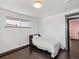 Well-lit bedroom featuring clean white walls, dark wood floors and a comfortable daybed at 8331 Oakwood St, Westminster, CO 80031