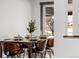 Dining area featuring a wood table set with plates, glasses and modern chairs at 8331 Oakwood St, Westminster, CO 80031