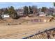 An expansive green space featuring a modern playground with blue and yellow equipment at 8331 Oakwood St, Westminster, CO 80031