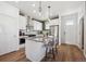 Bright kitchen with stainless steel appliances, kitchen island, and ample cabinet space at 940 Andrews Crest Dr, Berthoud, CO 80513