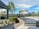 Poolside lounge area with shaded seating, landscaping, and community amenities at 940 Andrews Crest Dr, Berthoud, CO 80513