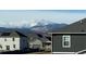 Neighborhood street view of newly built homes with a mountain backdrop at 940 Andrews Crest Dr, Berthoud, CO 80513