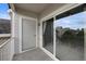 Outdoor balcony featuring a sliding glass door entrance and neighborhood views at 15700 E Jamison Dr # 3-307, Englewood, CO 80112