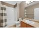 Bathroom boasting a shower-tub combo, vanity with sink, toilet, and neutral wall paint at 15700 E Jamison Dr # 3-307, Englewood, CO 80112