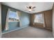 Spacious bedroom featuring neutral carpet, ample natural light, and soothing color palette at 15700 E Jamison Dr # 3-307, Englewood, CO 80112
