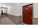 Well lit condo hallway leading to unit doors at 15700 E Jamison Dr # 3-307, Englewood, CO 80112