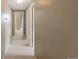 A neutral-toned hallway with multiple doorways and carpet flooring at 15700 E Jamison Dr # 3-307, Englewood, CO 80112