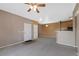 Open floor plan of the living room and kitchen with neutral walls and carpeted floors at 15700 E Jamison Dr # 3-307, Englewood, CO 80112