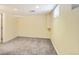 Unfinished basement with neutral walls and carpeted floor at 1650 Locust St, Denver, CO 80220