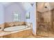 Spa-like bathroom with soaking tub and glass shower at 1650 Locust St, Denver, CO 80220