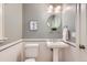 Classic powder room with pedestal sink and white tile at 1650 Locust St, Denver, CO 80220