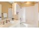 Clean bathroom with shower/tub combo and white tile at 1650 Locust St, Denver, CO 80220