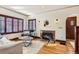 Cozy living room with hardwood floors, fireplace, and ample natural light at 1650 Locust St, Denver, CO 80220