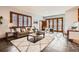 Spacious living room with tile floors, bright windows, and comfortable seating at 1650 Locust St, Denver, CO 80220
