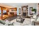 Open living area with a stone fireplace and kitchen views at 1650 Locust St, Denver, CO 80220