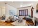 Light and airy living room with hardwood floors and comfy seating at 1650 Locust St, Denver, CO 80220