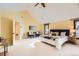 Spacious main bedroom with vaulted ceiling, neutral carpet, and bright windows at 1650 Locust St, Denver, CO 80220