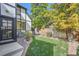 Landscaped side yard with grass and brick border at 1650 Locust St, Denver, CO 80220