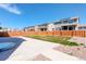 View of a nicely fenced backyard with a concrete patio and green grass, ideal for outdoor activities at 434 N Old Hammer St, Aurora, CO 80018
