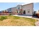 Backyard with a patio, grass area, and privacy fence provides a serene and private outdoor space at 434 N Old Hammer St, Aurora, CO 80018