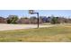 Outdoor basketball court, perfect for sports and recreation, is surrounded by lush green grass and beautiful community homes at 434 N Old Hammer St, Aurora, CO 80018