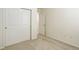 Bedroom featuring carpeted floors, white walls, closet with sliding doors and modern fixtures at 434 N Old Hammer St, Aurora, CO 80018