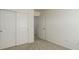 Bedroom featuring carpeted floors, white walls, closet with sliding doors and modern fixtures at 434 N Old Hammer St, Aurora, CO 80018