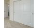 Bedroom featuring carpeted floors, white walls, closet with sliding doors and modern fixtures at 434 N Old Hammer St, Aurora, CO 80018