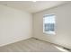 Bright bedroom with carpeted floors and a window for natural light at 434 N Old Hammer St, Aurora, CO 80018