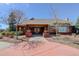 Stunning clubhouse with a brick facade, covered entrance, and welcoming landscaping at 434 N Old Hammer St, Aurora, CO 80018